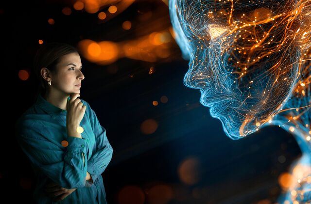 Quarks – Künstliche Intelligenz schreibt Texte, übersetzt Sprachen, erkennt Bilder, imitiert Stimmen. Was vor wenigen Jahren noch nach Zukunft klang, ist längst Alltag: in Schule und Büro, in Medizin, Forschung und Industrie. Doch je mehr Lebensbereiche KI erobert, desto wichtiger wird die Frage: Was kann sie wirklich — und wo wirkt sie klüger als sie ist? - (Archivfoto: Frau analysiert das Gesicht eines KI-Chatbots mit einem leuchtenden digitalen Netzwerkmodell)