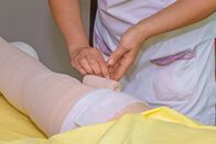 Doc Fischer – Lymphedema management: Wrapping leg using multilayer bandages to control Lymphedema. Part of complete decongestive therapy (cdt) and manual lymphatic drainage (MLD)