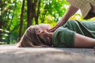 Marktcheck – Unconscious fainted girl having pulse checked by an old woman. Teenager lying on the ground while her pulse is verified by an elder citizen on teen’s carotid artery