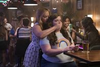 I Feel Pretty – Behind: Renee Bennett (Amy Schumer) In front: Vivian (Aidy Bryant)