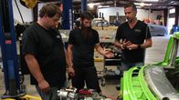 Fast N' Loud – L-R: Jordan Butler, Aaron Kaufman and Richard Rawlings survey the 56 Chevy Nomad engine.