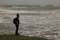 I Wouldn't Go In There – Diu, India: RJ standing by the sea. The sea has always been a big part of Diu. Diu has seen its fair share of natural sea disasters and wars that have taken place at sea. The main occupation of the locals of Diu is fishing, a dangerous trade subjected to the state of the sea. (Photo Credit: National Geographic Channels/Singha Quansuwan)