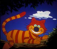 Alice im Wunderland – Die Grinsekatze tut das, was sie am liebsten tut. Sie grinst.