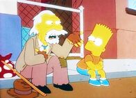 Die Simpsons – Der Obdachlose Chester erklärt Bart, dass er die Figur des Itchy erfunden hat.