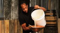 Moonshiners: Master Distiller – Thomas pouring out his bucket