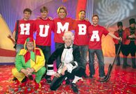 Meenzer Konfetti – SWR Fernsehen MEENZER KONFETTI Uhr. hintere Reihe: Thomas Neger (Mi.) mit seinen "Humbas", vorne Nick Benjamin (li.) und Martin Seidler, hier im Jahr 2011
