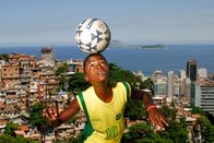 Atlas – Boy with soccer ball, overlooking the city of Rio de Janeiro .