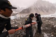 Expedition Everest – Heather Clifford, Ram Magar, and Tek Magar prepare a drill in order to retrieve an ice core at Everest Base Camp during the National Geographic and Rolex Perpetual Planet Everest Expedition. (National Geographic Society/Mark Fisher)