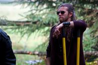 Alaskan Bush People – Bam Brown leans on a shovel.