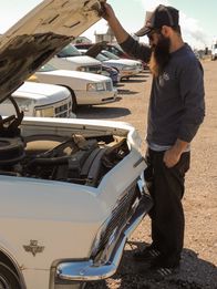 Fast N' Loud – Richard Rawlings and Aaron Kaufman looking at the 1965 Chevy Impala in a junkyard.