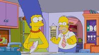 Die Simpsons – Marge (l.); Homer (r.)