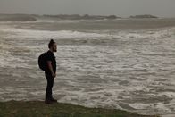 I Wouldn't Go In There – Diu, India: RJ standing by the sea. The sea has always been a big part of Diu. Diu has seen its fair share of natural sea disasters and wars that have taken place at sea. The main occupation of the locals of Diu is fishing, a dangerous trade subjected to the state of the sea. (Photo Credit: National Geographic Channels/Singha Quansuwan)