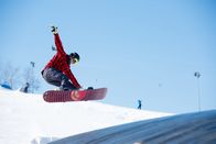 Snowboard: Weltcup – Young man jumping with snowboard