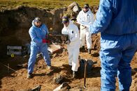 Mayday - Alarm im Cockpit – REENACTMENT - NTSB Investigators (played by background performers) in protective clothing recover wreckage from the impact crater of the plane crash that killed world famous golfer Payne Stewart. (Photo Credit: Cineflix/Ian Watson)