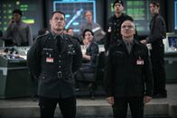 Bumblebee – L-R: Agent Burns (John Cena) , Dr. Powell (John Ortiz)