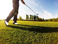 111 – Golfer performs a golf shot from the fairway.