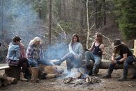 Alaskan Bush People – Rain, Ami, Billy, Bird, Bear, and Bam Brown around the family campfire.