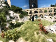 Die Modellbauer - Das Miniatur Wunderland – A small detail within the miniature wonderland, a model of a painter while painting.