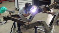 Fast N' Loud – Aaron Kaufman, wearing a large head light, works on the fram of the 1976 Chevy Silverado C-10.