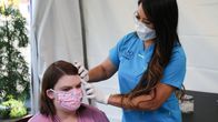 Dr. Pimple Popper – Dr. Lee examines Lattyse in the Covid tent.