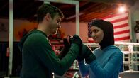 Navy CIS: L.A. – ‚ÄúImposter Syndrome‚Äù - Pictured: Garrett Coffey (Rob Black) and Medalion Rahimi (Special Agent Fatima Namazi). NCIS obtains a hard drive containing a realistic deep fake video of a deceased terrorist and must retrieve the dangerous technology behind it. However, when the team‚Äôs comms are highjacked during their mission, they find that one of their own has been a victim of its potential, on NCIS: LOS ANGELES, Sunday, May 2 (9:00-10:00 PM, ET/PT) on the CBS Television Network. Photo: Screen Grab/CBS ¬