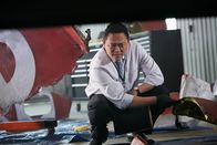Mayday - Alarm im Cockpit – ONTARIO - RE-ENACTMENT - NTSC Investigator (played by Redd Ochao) sorts through the wreckage of flight 8501 in the hanger.  