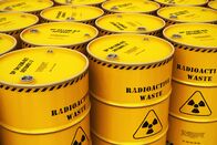 Quarks – Creative abstract nuclear power fuel manufacturing, disposal and utilization industry concept: 3D render illustration of the group of stacked yellow metal barrels, drums or containers with poison dangerous hazardous radioactive materials in the industrial storage warehouse with selective focus effect