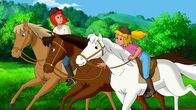 Bibi und Tina – Bibi (r.) und Tina (l.) reiten auf Sabrina und Amadeus der türmenden Cleopatra hinterher.