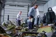 Mayday - Alarm im Cockpit – TSB Investigators Mike Cunningham (played by Judah Katz) and Alan Chaulk (played by Glen McDonald) walk through the remains of Cougar Helicopters Flight 91. (Darren Goldstein/Cineflix 2019)