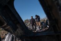 Mayday - Alarm im Cockpit – REENACTMENT - The Main Investigator (played by RJ Parrish) surveys the crash site of US-Bangla Airlines Flight 211, while another investigator documents the wreckage. (Cineflix 2020/Darren Goldstein)