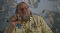 When Sharks Attack - Hai-Alarm – FLORIDA- Shark Expert George Burgess discusses shark tooth from taken from the spine of a shark attack victim. (Photo credit: National Geographic Channels/Dane Lawing)