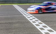 Motorsport: Le Mans Cup – Race car racing on speed track with motion blur