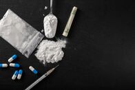 ATV - Die Reportage – Cocaine and other drugs on a black background, close-up.
