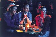 Sweet November – L-R: Brandon (Michael Rosenbaum), Chaz Watley (Jason Isaacs), Sara Deever (Charlize Theron)