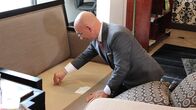 Hotel Impossible – Anthony inspects a couch in the lobby of the Curve Hotel, as seen on Travel Channel's Hotel Impossible.