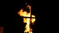 Obsession - Dunkles Verlangen – A burning cross.