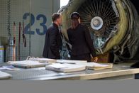 Mayday - Alarm im Cockpit – REENACTMENT - The Main Investigator (played by Mark Gibson) and the Second Investigator (played by Jenny Young) analyze the engine of downed UPS Flight 1354 to see what caused it to crash. (Cineflix 2021/Darren Goldstein)