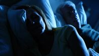 Your Worst Nightmare – A man and woman laying in bed at night.