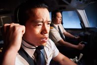 Mayday - Alarm im Cockpit – TORONTO - RE-ENACTMENT - F.O. Gunawan (played by Minh Le) radios out â€Mayday', Captain Rozaq (played by Leon Aureus) can be seen in the background.