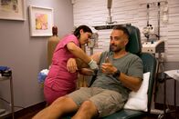 Dr. Pimple Popper – Luis gives a thumbs up after surgery as Medical Assistant Val wraps up his arm.