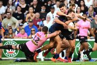 Rugby: NRL Telstra Premiership – NRL STORM PANTHERS, Storm Ryan Papenhuyzen (2.v.l.) is tackled during the NRL Preliminary Final match between Melbourne Storm and Penrith Panthers at Suncorp Stadium in Brisbane, Saturday, September 25, 2021.