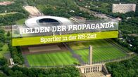 Helden der Propaganda – Titel "Helden der Propaganda - Sportler in der NS-Zeit" über dem Olympiastadion von Berlin.
