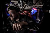 Kriegshölle unter Wasser – REENACTMENT - Captain Heinrich Timm commands the crew of the U-862 to fire torpedos at the Robert J. Walker. L-R: Kilian Weber, Leszek Brugmann, Heiner Schluck. (Pacific Fleet Productions II Inc./Sean White)