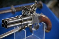 Die Waffensammler – A four-barelled pistol with ornate detailing sits on display at the auction.