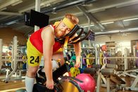 111 – A fat man is tired on a simulator in the gym