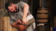 Moonshiners: Master Distiller – Travis pouring mash in his still