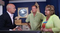 Hotel Impossible – Host Anthony Melchiorri reveals the new reservation system to Tammy and Terry Bork in the lobby of the Beachfront Inn, Bailey's Harbow, WI, as seen on Travel Channel's Hotel Impossible.
