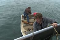 Alaskan Bush People – L-R: Matt Brown and Gabe Brown working on skiff.
