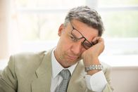 Was ist gut an ... – Close-up Of Sad Mid-adult Businessman In Office