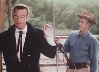 Josh: Der Kopfgeldjäger – Leo Torrance (Gerald Mohr, l.); Josh Randall (Steve McQueen, r.)